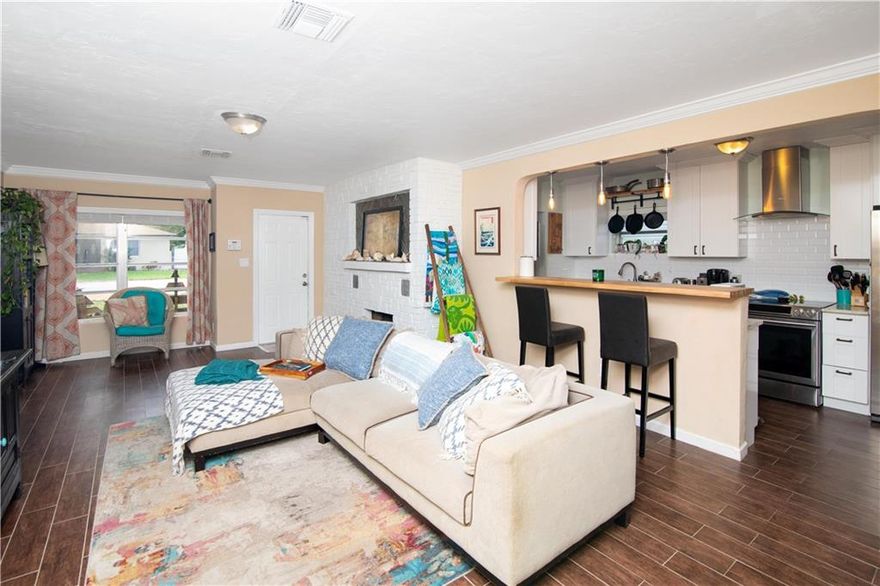 This is a wonderful 3/2 pool home with old school Florida charm!  This home boasts a great open layout, a newer roof, renovated kitchen, landscaped and fenced backyard.  There is also a working fireplace to add to the uniqueness of this property.  It has 1615 sq. ft. under air, larger than most homes in the area.  A great home for any buyer!