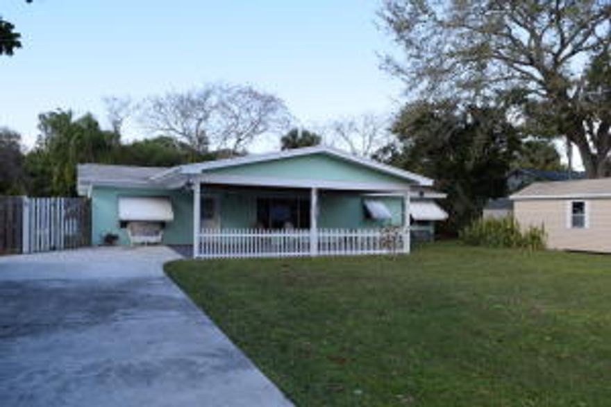 Unique, quaint CBS pool home w/4 bedrooms & den on 1/3 acre off of E. Weatherbee in Fort Pierce. Wood laminate & tile floors throughout home - no carpet! Wood kitchen cabinets & black appliances. Sunken dining room off kitchen w/pocket doors leading to utility room. French door leading from dining room to open pool & patio. 3 bedrooms w/1.5 baths on one side of house; mother-in-law suite area off kitchen has a bedroom w/half bath & den/office/family room. Fully fenced yard with swing/play set. Large driveway w/carport. 2 sheds - larger one is negotiable. Natural gas for stove, water heater, & dryer. This 1954 home boasts tons of character & offers lots of options & room for growth. Priced to sell. Contact us today to preview this home!
