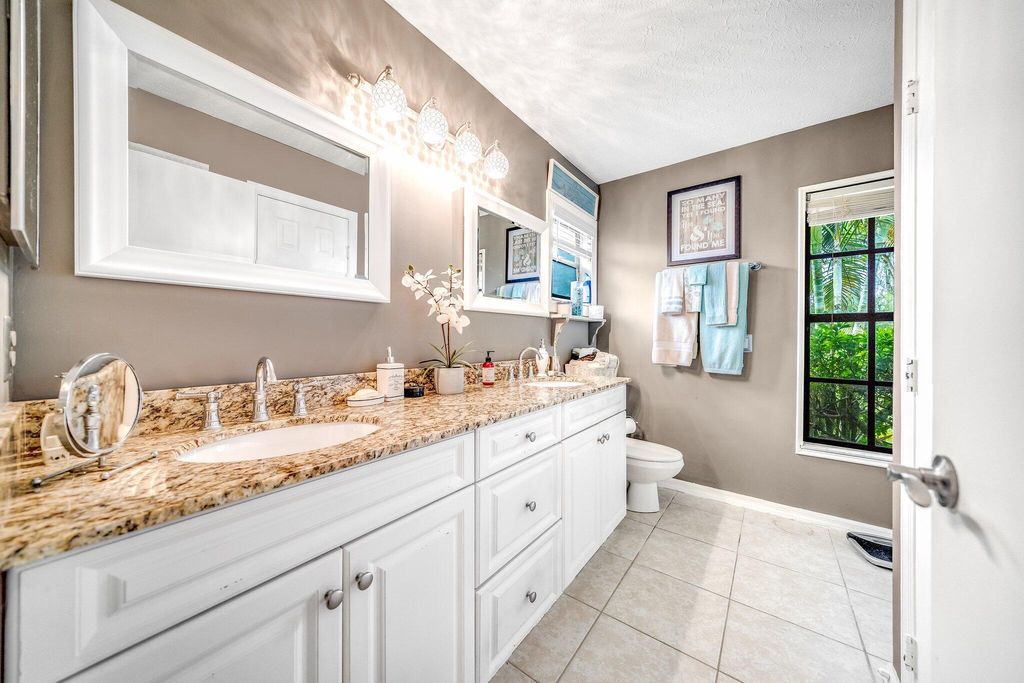 Photo of 401 SE Glenwood Drive, Port St Lucie, FL 34984 (MLS # R10853397)