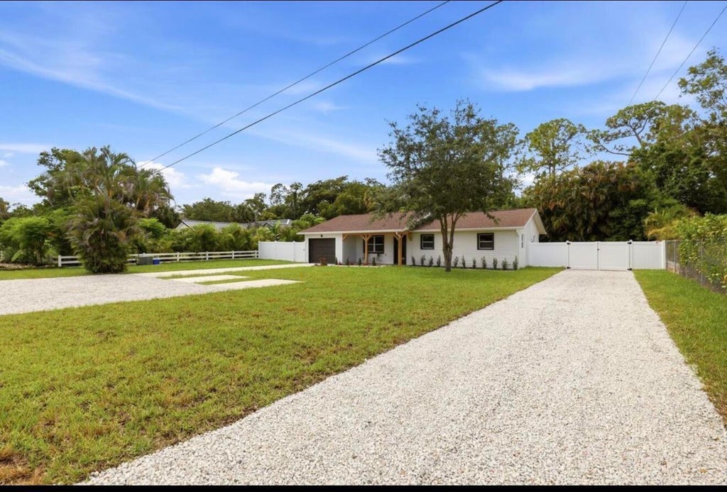 Photo of 15409 Los Angeles Drive, Loxahatchee, FL 33470 (MLS # B26079827)