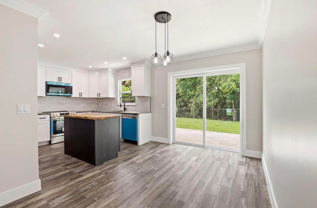 Photo of 15409 Los Angeles Drive, Loxahatchee, FL 33470 (MLS # B26079827)