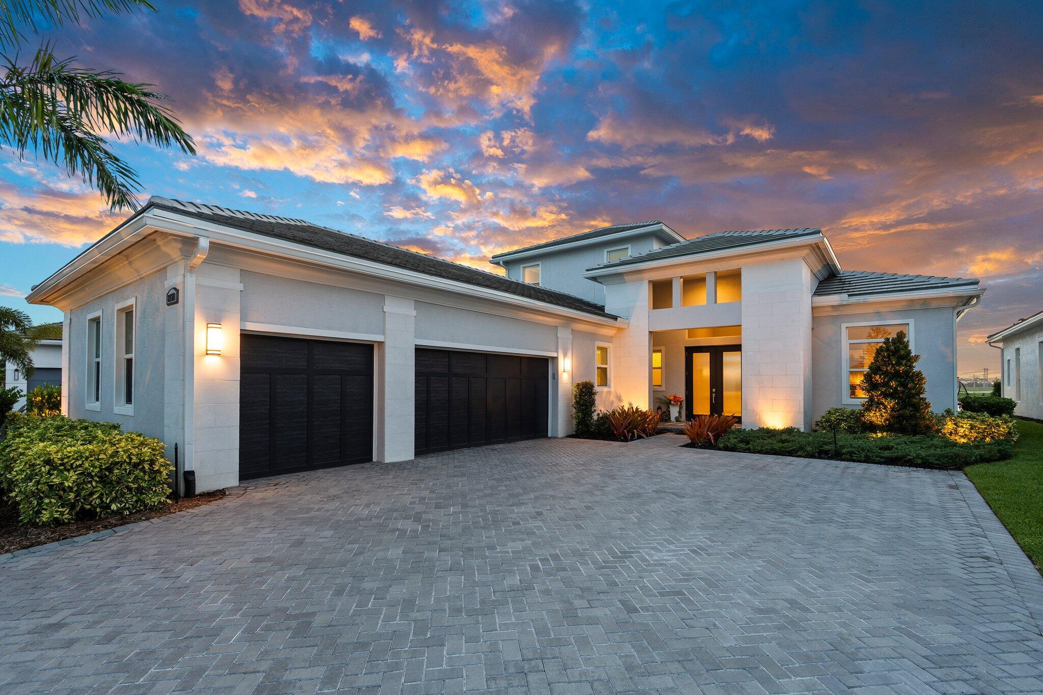 Experience unparalleled luxury in this brand-new Bellacerra model at PGA Village Verano. Offering 3563 sqft of beautifully designed living space, this home features 3 spacious bedrooms, 3.5 baths, a den, clubroom, & an upstairs bonus suite complete with a full bath & separate living area--perfect for guests. The chef's kitchen is truly exceptional, boasting a 3'' quartz island, a 36'' cooktop w/ hood, under-counter wine fridge, & a butler's pantry for extra storage & prep space. Step outside to the extended lanai with a built-in outdoor kitchen, all overlooking tranquil lake views. Built with hurricane impact windows & doors, CBS construction, & a durable concrete tile roof, this home expertly combines elegance, comfort, & peace of mind for a lifestyle of true resort-style living.