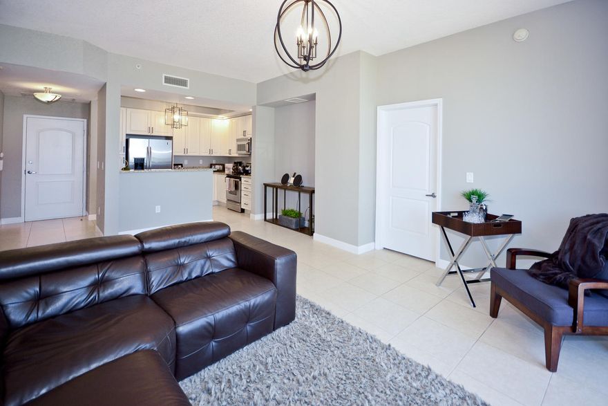East Facing 2/2 +Den, 2 double large storage units and stand alone parking space.  Nice views of the Bay, Intracoastal , Breakers and Palm Beach from every room. Recently refurbished.Clean contemporary feel. This unit has same floor parking. Great views for SunFest and 4th of July Fireworks!
