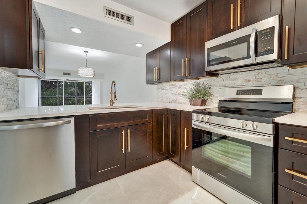 Photo of 6181 Balboa Circle #303, Boca Raton, FL 33433 (MLS # B26023290)