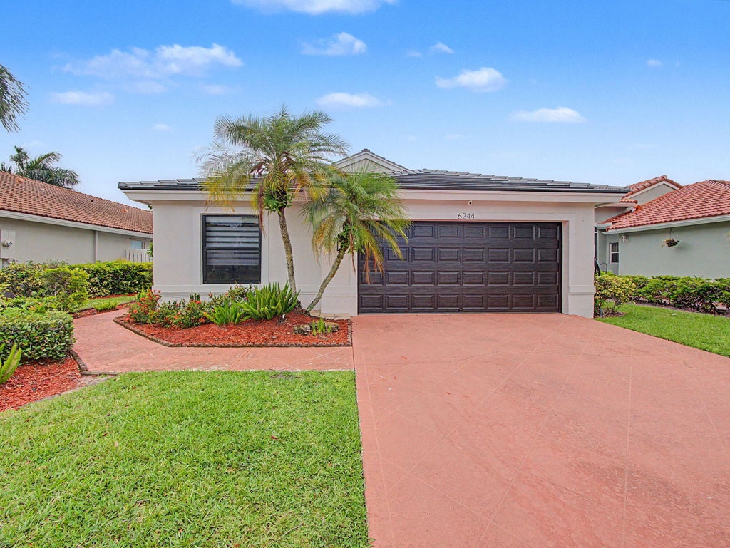 Photo of 6244 Grand Cypress Circle, Lake Worth, FL 33463 (MLS # B26037560)