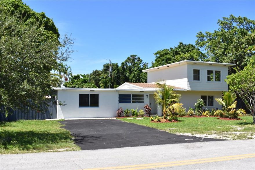 4 Bedroom 3 1/2 bath totally remodeled home located in Biscayne Gardens. Home features New Roof, New AC, New Electrical System, New Plumbing System, New Septic System, New driveway, Italian Travertine throughout, Wood Kitchen with granite countertops, Italian modern vanities in all bathrooms, 2 Master suites; 1 with its own entry that could be used as in-laws quarters, lush landscaping, 2nd floor with 2 bedrooms overlooking oversized fully fenced backyard and free form pool. Huge pool deck made for entertaining. Backyard is enormous and great for kids playing. ALL WORK COMPLETED WITH PERMITS and ALL INSPECTIONS COMPLETED! Closing must be with seller's title company; Fidelity National Title.  HOME IS PRICED TO SELL!  SELLER SAYS BRING OFFERS!