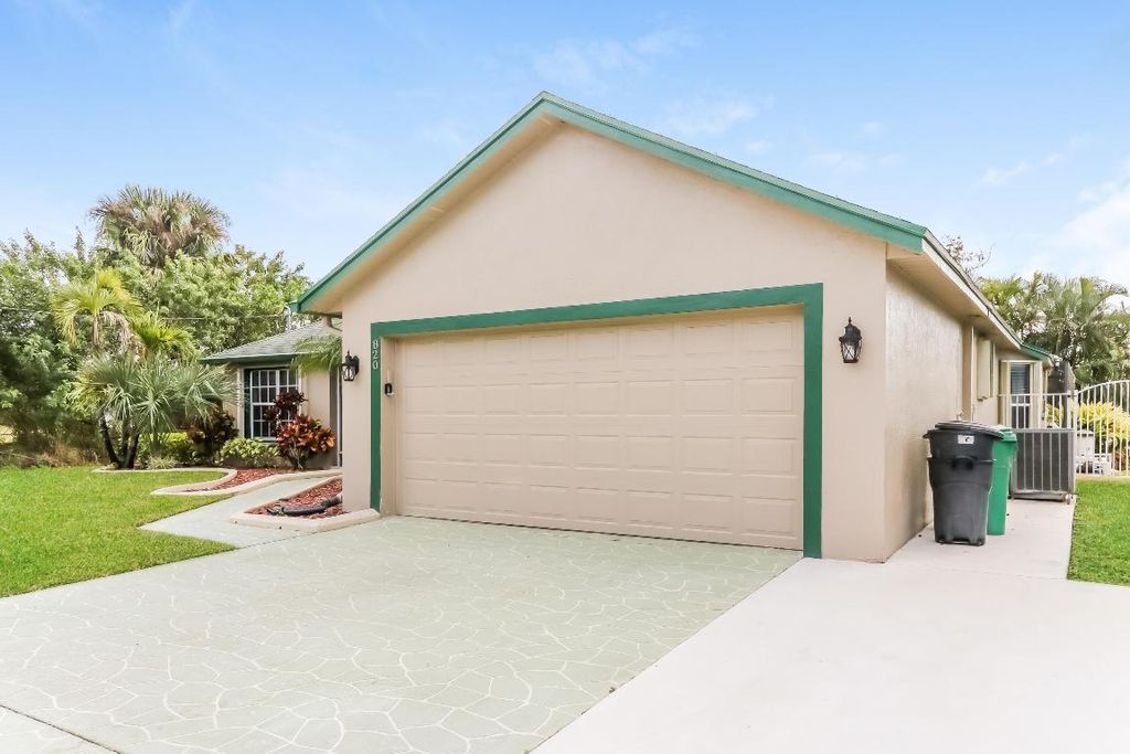 Photo of 820 SW Dalton Avenue, Port Saint Lucie, FL 34953 (MLS # R10976170)