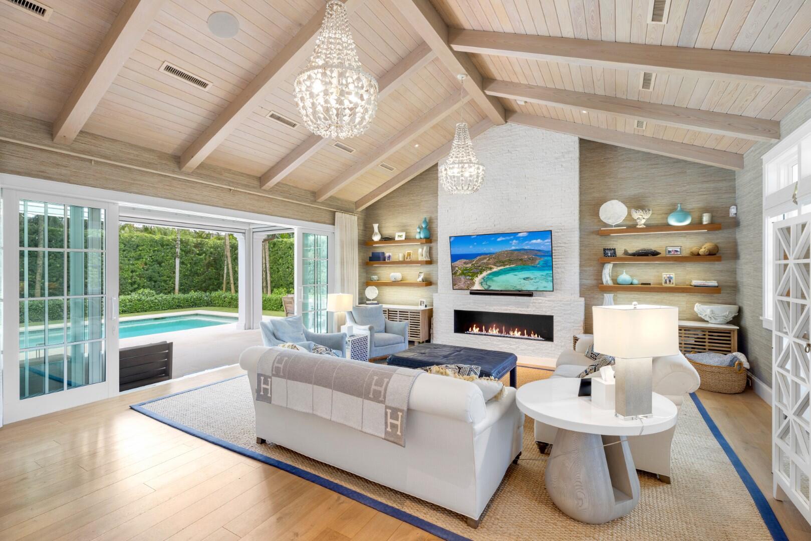 Stunning 4BR/4.1BA Island Colonial home custom built in 2017 and located on the sunny South side of Seagate Road. Open floor plan beautifully designed by Daily Janssen Architects. Living room features wall-to-wall pocket sliding doors, vaulted and beamed ceiling, and gorgeous brick fireplace. Light and bright dining room is lined with large windows. Pristine gourmet kitchen featuring Bianco Superiore Quartzite countertops, pantry, and oversized chef's island with seating for 5. Top-of-the-line appliances include 48'' gas range, wine fridge, microwave drawer, 30'' refrigerator and freezers, and dual dishwashers. Beautiful wood and marble tile flooring throughout. First floor primary suite features office, built-in cabinetry, and oversized bath and closet.