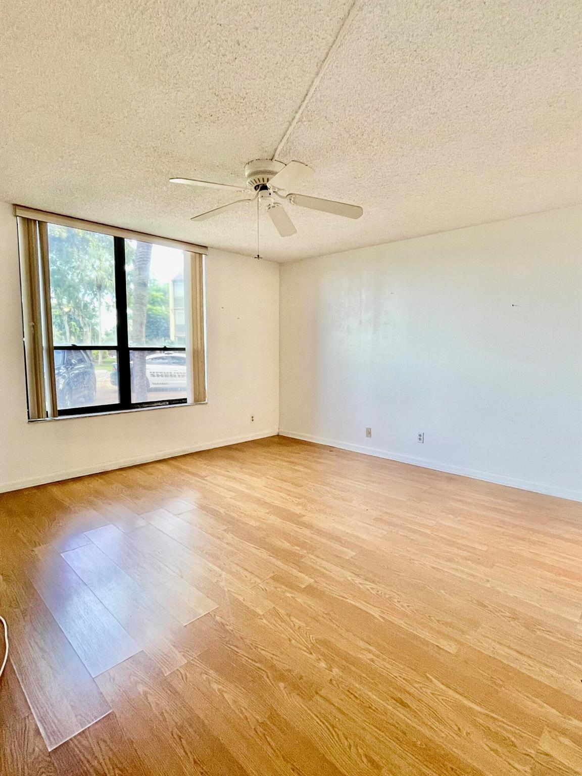Bring ALL offers!! Can qualify for grant programs for closing cost assistance with prefered lender - use of preferred lender not required for purchase. Incredible opportunity in an ALL-AGES community in Tamarac. This spacious FIRST-FLOOR condo offers excellent value--listed BELOW recent appraisal VALUE and ready for a quick sale. Located right next to Community POOL. This large 1-bedroom, 1.5-bath features a functional layout and direct access to a private screened-in patio, just steps from your assigned parking space. Whether you're relaxing outside or bringing in groceries with ease, the ground-level access makes everyday living convenient. There's also plenty of guest parking available.The HOA fee includes water, sewer, cable,