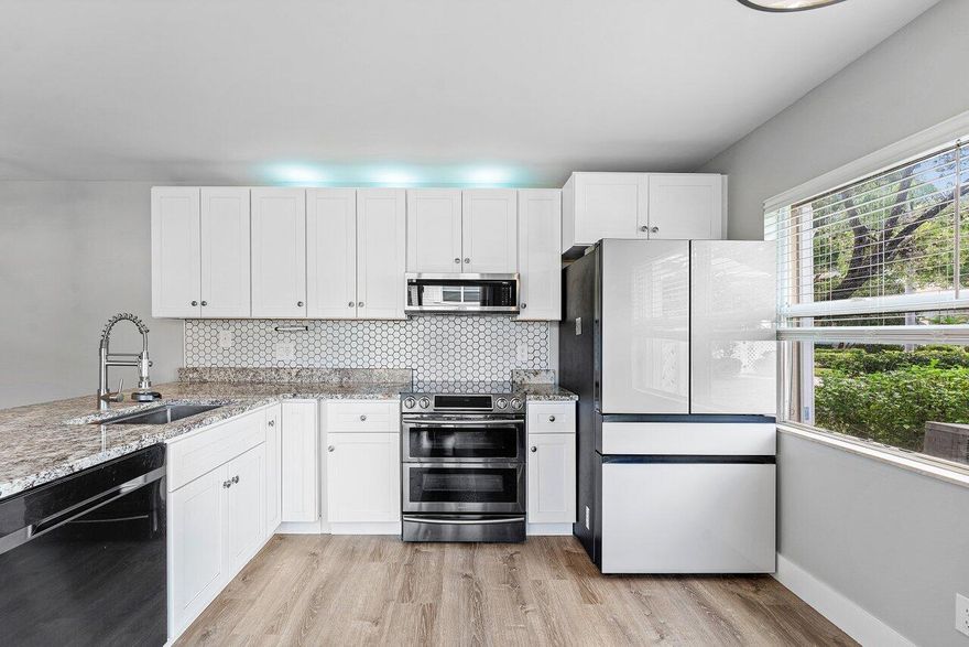 A charming renovated 2-bedroom townhome nestled in the sought-after gated community of Wellesley at Lake Clarke Shores. Bright, airy, and move-in ready, this home impresses with modern finishes and a dual-master layout perfect for privacy and comfort. 
Step inside to a spacious living area with flat ceilings, new flooring, and an abundance of natural light. The updated kitchen features crisp white cabinetry, stainless steel appliances, a double-door oven, welcoming bar, and a white glass French door refrigerator that complements the clean, modern aesthetic.
Upstairs, both bedrooms offer on-suite baths, walk-in closets with built-in storage, creating two true master suites. Additional highlights include accordion shutters, modern fixtures, and thoughtful design details throughout. Outside you have a large fenced in open patio ideal for relaxing and entertaining.Enjoy the peace of mind of living in a gated community with beautifully maintained grounds and a welcoming neighborhood feel.Experience modern comfort and timeless style in one of Lake Clarke Shores' most desirable communities. This home offers both convenience and charmall while being minutes from the shops, dining, and vibrant energy of downtown West Palm Beach. Whether you're seeking a serene retreat or a well-located spot close to it all, this is the perfect place to call home.