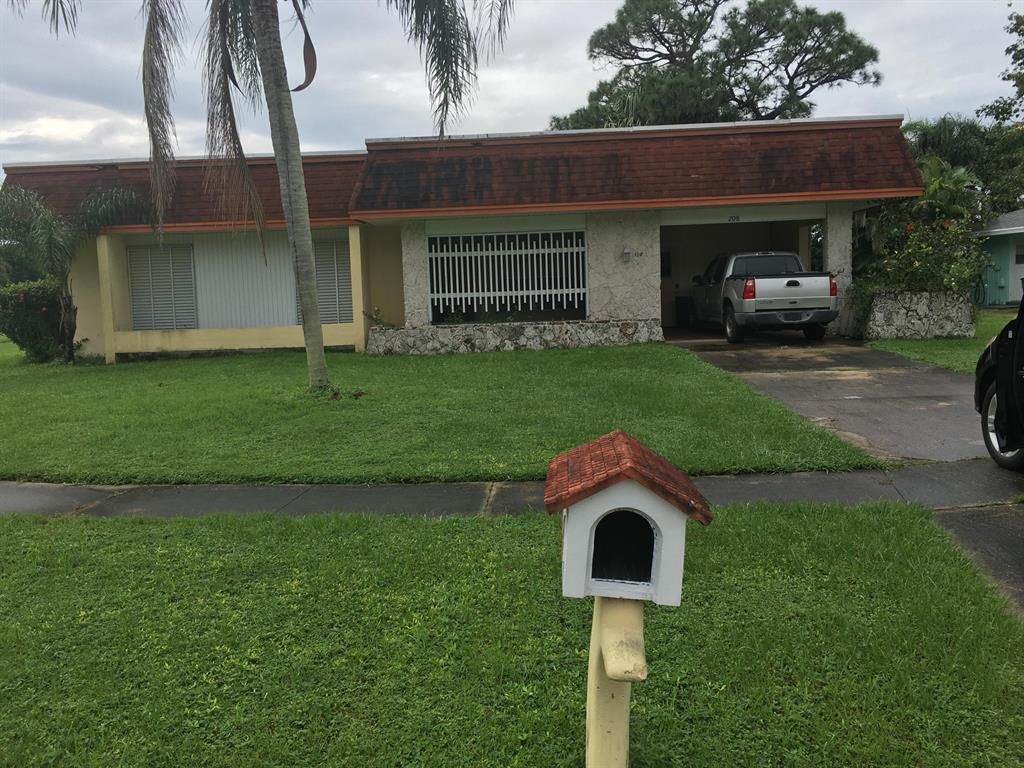 Photo of 208 NE Bracken Road, Port Saint Lucie, FL 34983 (MLS # R10751086)