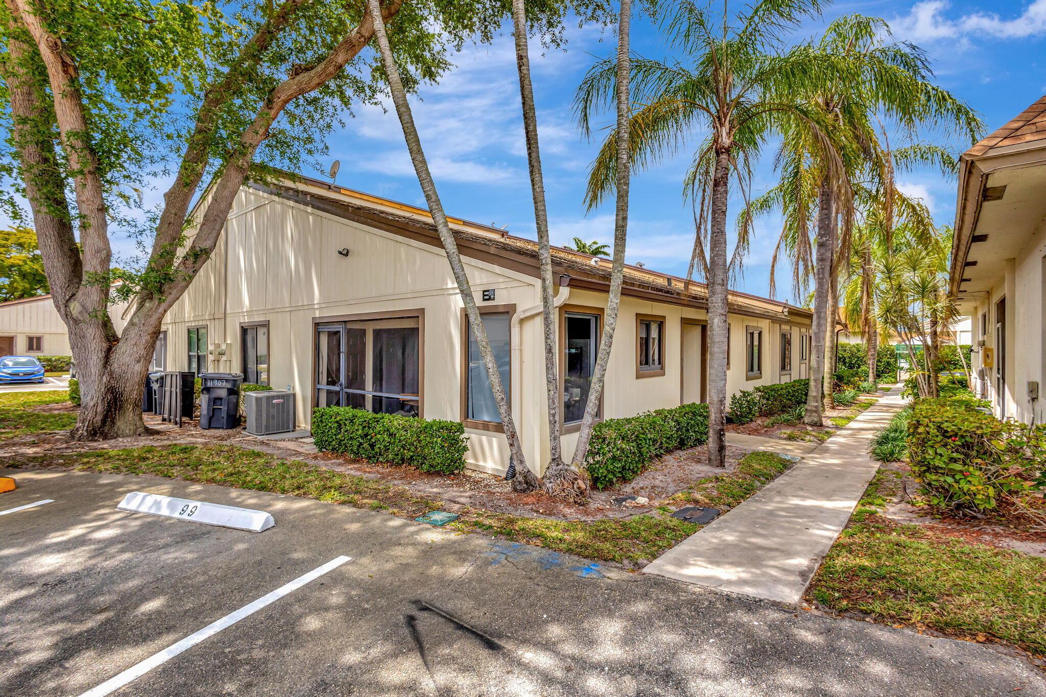 Chic finishes, vaulted ceilings, and a 2023 roof--this is the one you've been waiting for. This beautifully updated 3-bedroom, 2-bath villa offers an open floor plan filled with natural light and modern touches throughout. The custom kitchen features cream wood cabinetry, granite countertops, and stainless steel appliances--perfect for everyday living and entertaining. Wood-look tile runs through the main living areas, accented by updated fans and lighting. The spacious primary suite includes dual sinks, a granite vanity, and ample storage. Enjoy access to the community pool, all within a well-maintained Wellington neighborhood close to shops, dining, and top-rated schools. Move-in ready and stylishly finished--welcome home.