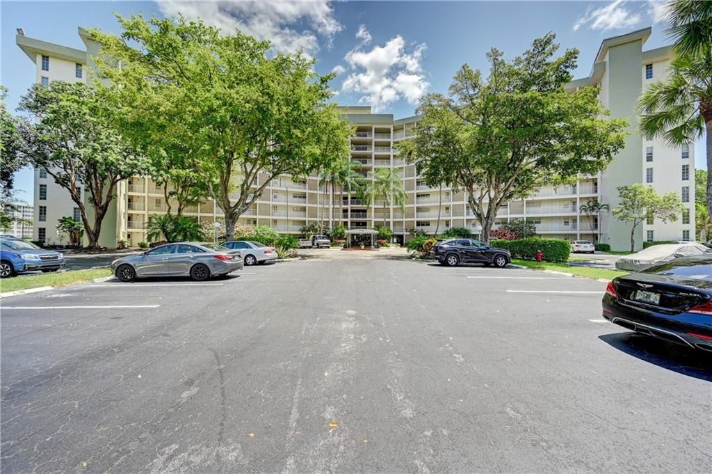 Photo of 3051 N Course Dr #709, Pompano Beach, FL 33069 (MLS # F10330429)