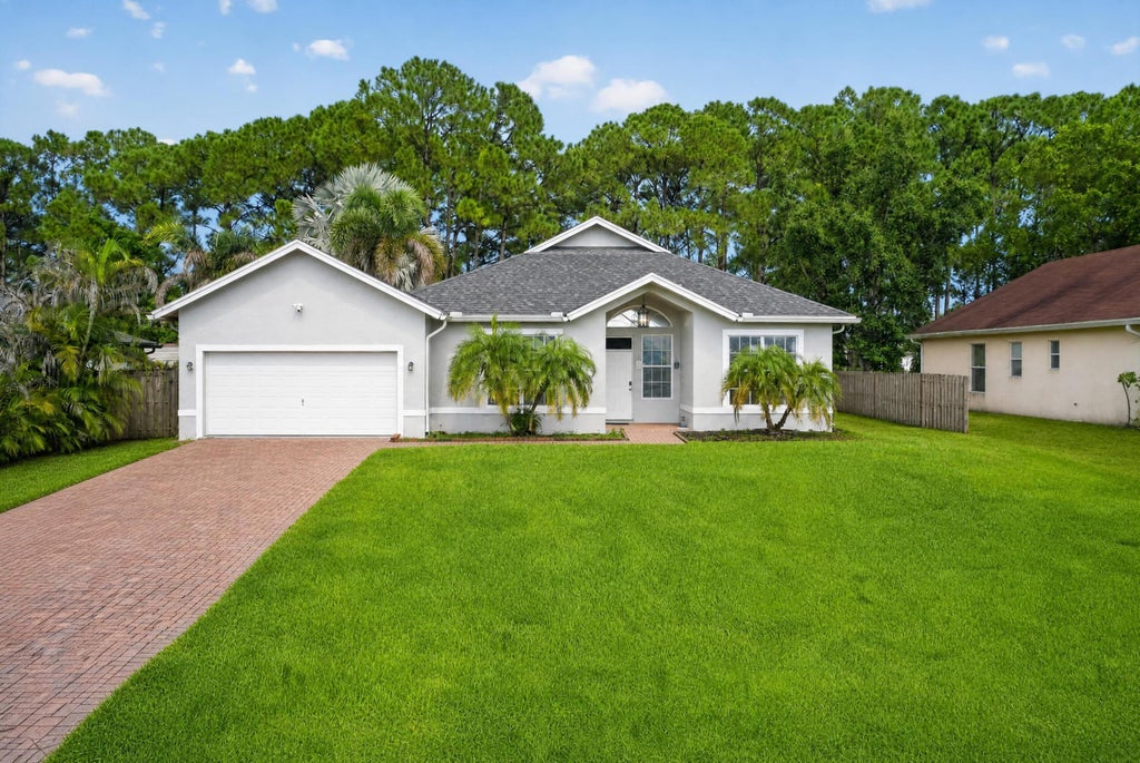 Photo of 4059 SW Kamsler Street, Port Saint Lucie, FL 34953 (MLS # B26063954)