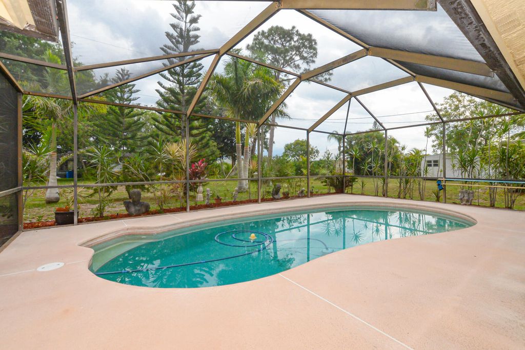 Photo of 1925 SE Airoso Boulevard SE, Port Saint Lucie, FL 34984 (MLS # R10988633)