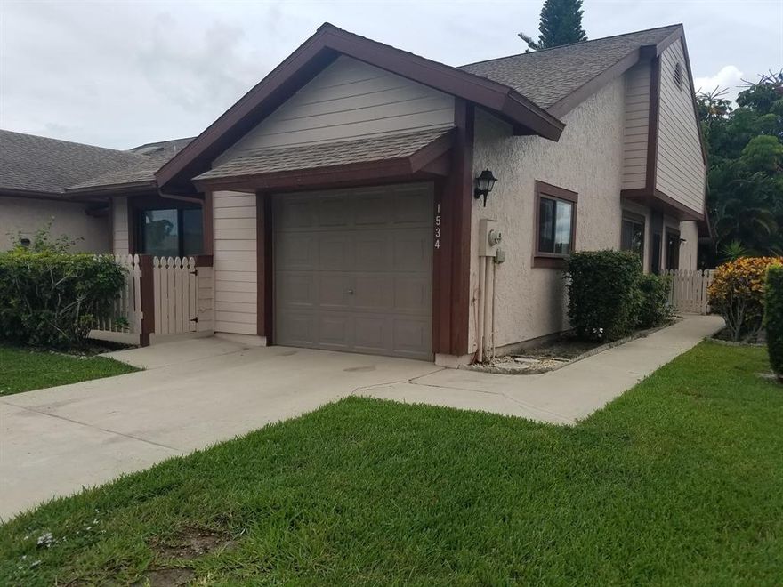 Beautiful A unit with large florida room attached.  New windows, accordian shutters, all hard surface floors.  Excellent condition.