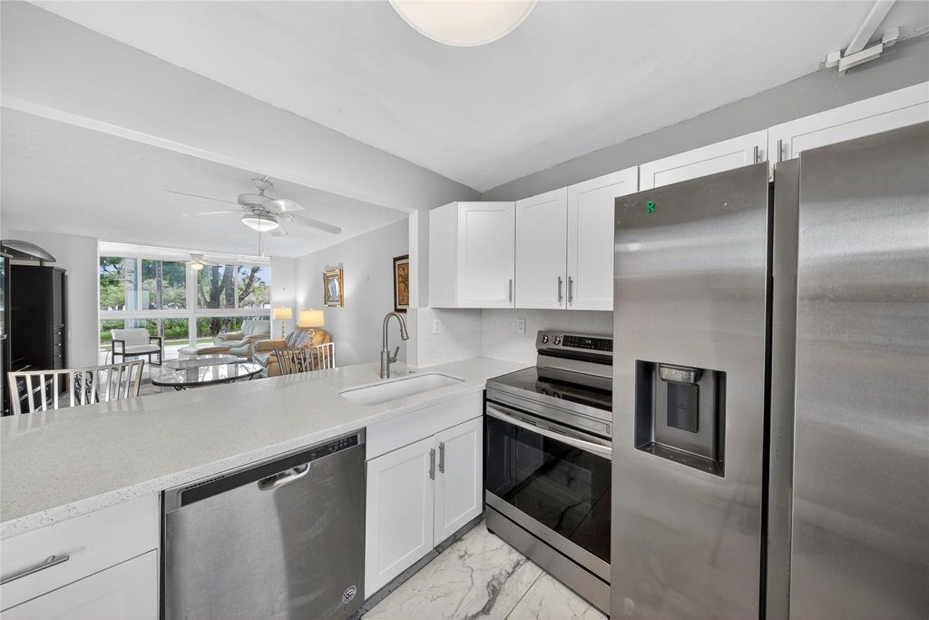 Photo of 9351 Lime Bay Blvd #212, Tamarac, FL 33321 (MLS # F10533581)