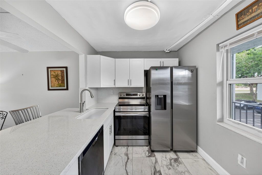 Photo of 9351 Lime Bay Blvd #212, Tamarac, FL 33321 (MLS # F10533581)