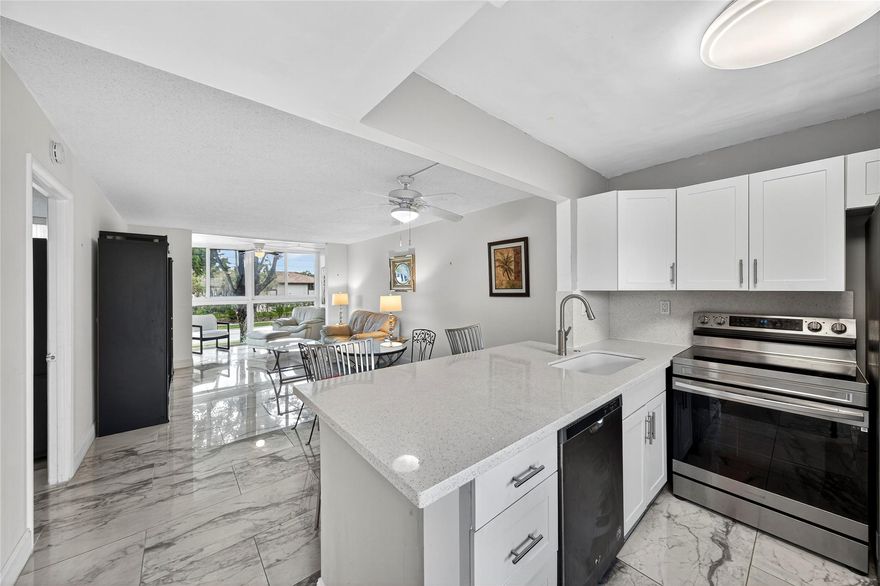 Beautifully updated 1 bed/1 bath condo in 55+ community featuring full impact windows throughout! Enjoy the modern feel of oversized porcelain tile flooring and an open-concept kitchen with stainless steel appliances and quartz countertops. The enclosed patio is filled with natural light - perfect for morning coffee or relaxing after a long day. The spacious bedroom offers a walk-in closet and large ensuite bathroom. Building was recently renovated, this community offers full amenities including a pool, clubhouse, tennis courts, fitness center, and more. Low maintenance fees include cable and internet. Prime location close to shopping, dining, and major highways. No leasing during the first 2 years of ownership; leasing limited to 1x per year thereafter for minimum of 90 days & up to 1 yr.