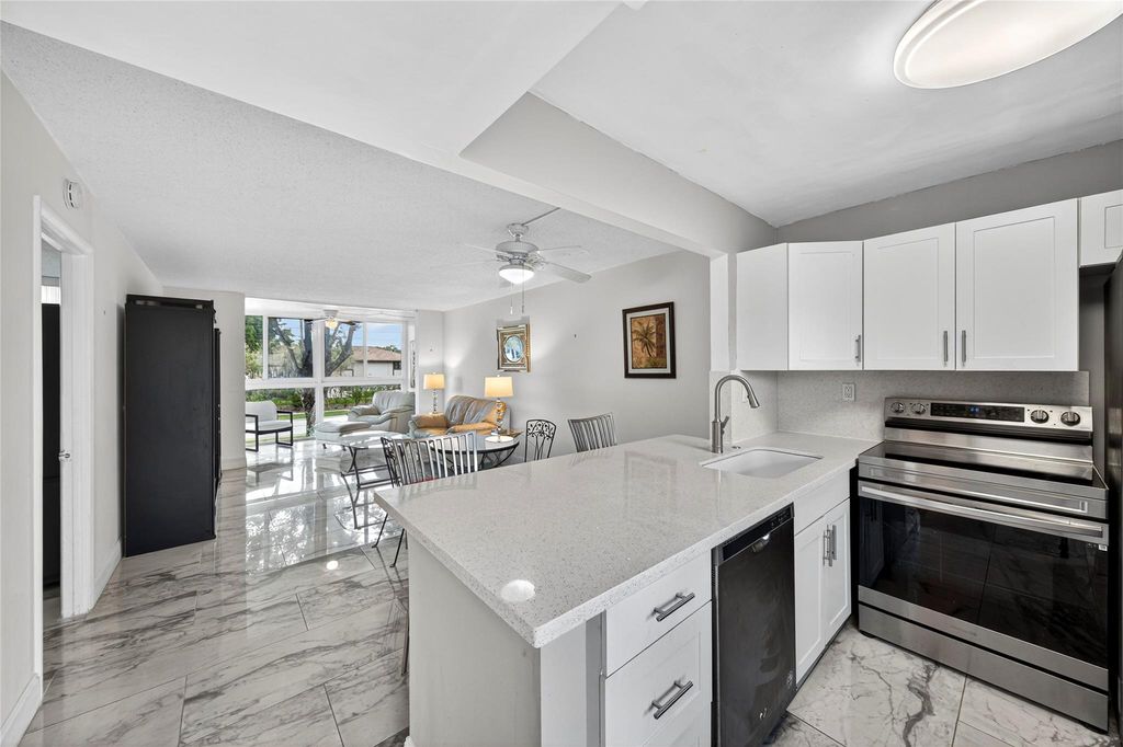 Photo of 9351 Lime Bay Blvd #212, Tamarac, FL 33321 (MLS # F10533581)