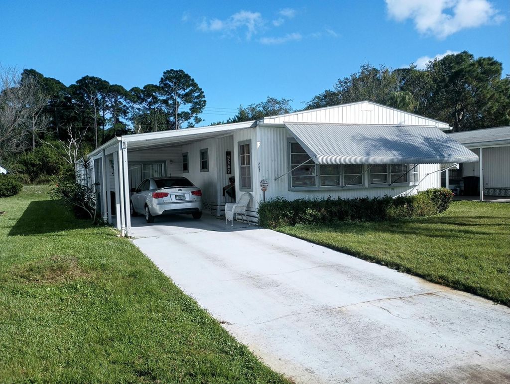 Photo of 207 Camino Del Rio, Port Saint Lucie, FL 34952 (MLS # R10940182)