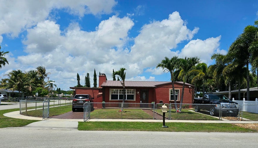 Just Listed! Welcome to this beautiful move-in-ready 4-bedroom, 2-bathroom corner-lot home with no HOA located in the heart of West Palm Beach. Conveniently situated just minutes from downtown, Palm Beach International Airport, shopping, dining, schools, and major highways. Offering 1,296 sq ft of living space and 1,908 total sq ft, this home features a versatile layout with an additional family room, a remodeled kitchen, and a screened-in lanai ideal for indoor-outdoor living. Enjoy a fully fenced yard with a storage shed for added functionality and storage space. This is a wonderful opportunity to own a move-in-ready home with comfort, space, and convenience in a prime West Palm Beach location.