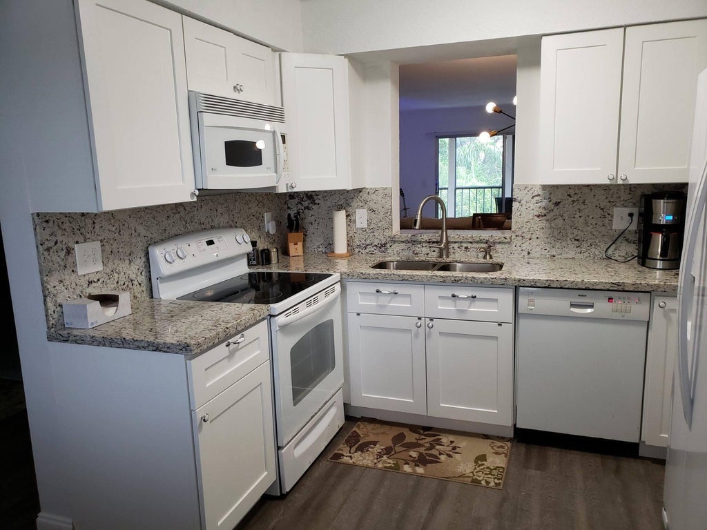 Photo of 7281 Amberly Lane #401, Delray Beach, FL 33446 (MLS # B26056642)