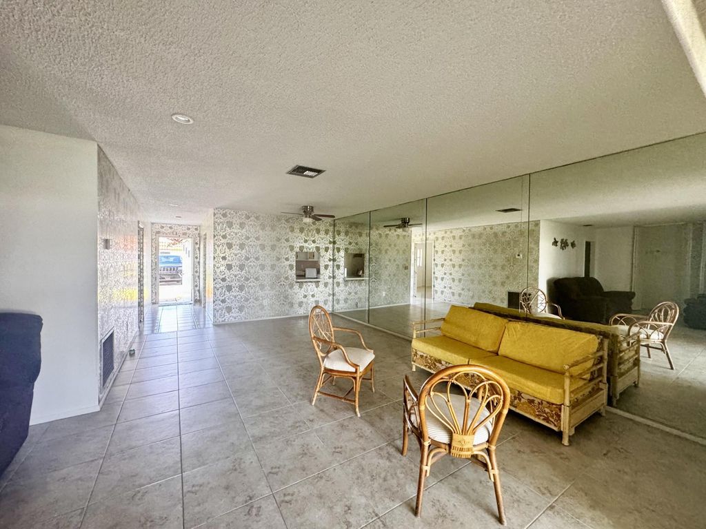 Photo of 5725 E Fernley Dr Drive E #65, West Palm Beach, FL 33415 (MLS # B26026799)