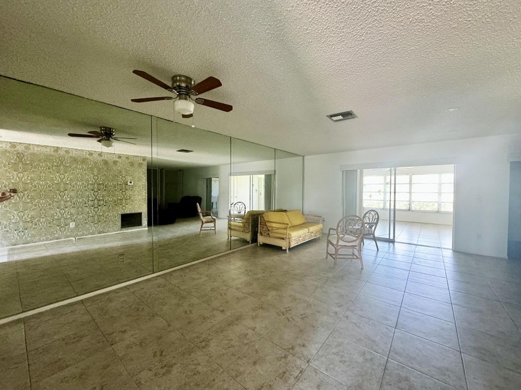 Photo of 5725 E Fernley Dr Drive E #65, West Palm Beach, FL 33415 (MLS # B26026799)
