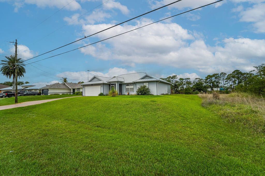 Photo of 2366 SW Alminar Street, Port Saint Lucie, FL 34953 (MLS # B26014203)