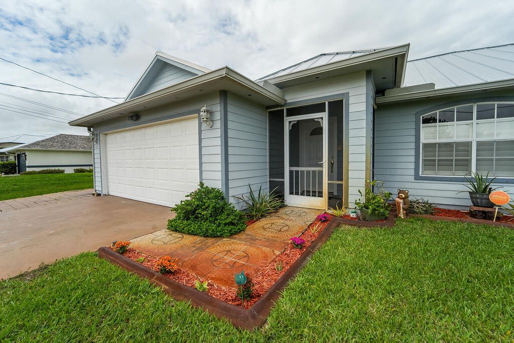 Photo of 2366 SW Alminar Street, Port Saint Lucie, FL 34953 (MLS # B26014203)