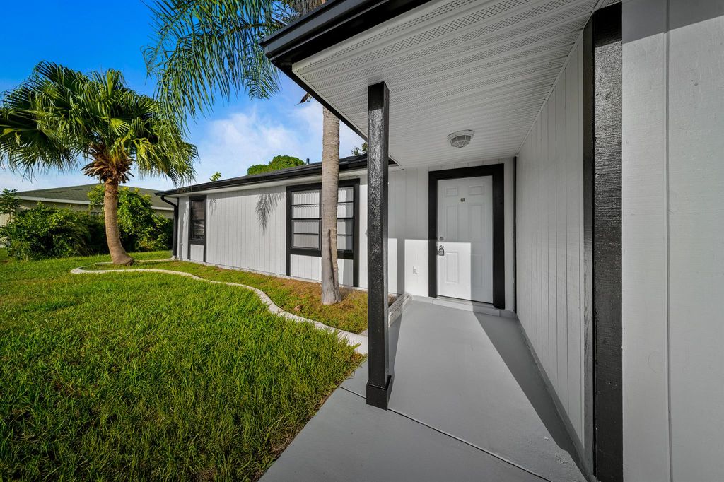 Photo of 2955 SW Varsity Lane, Port Saint Lucie, FL 34953 (MLS # R11117059)