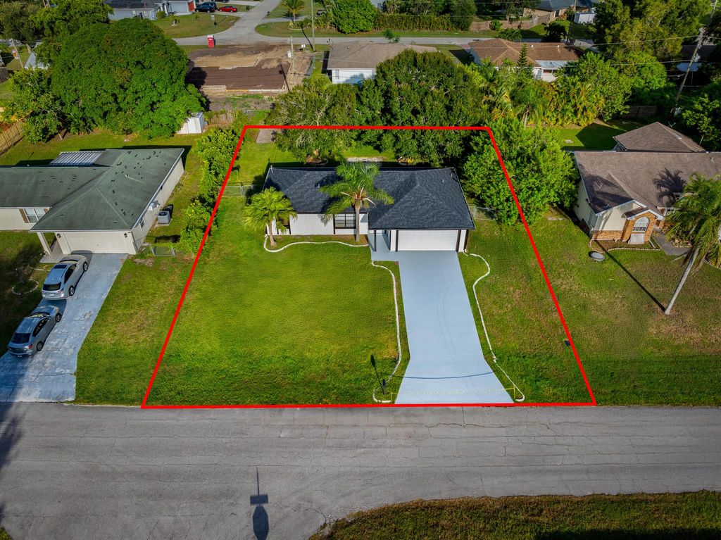 Photo of 2955 SW Varsity Lane, Port Saint Lucie, FL 34953 (MLS # R11117059)