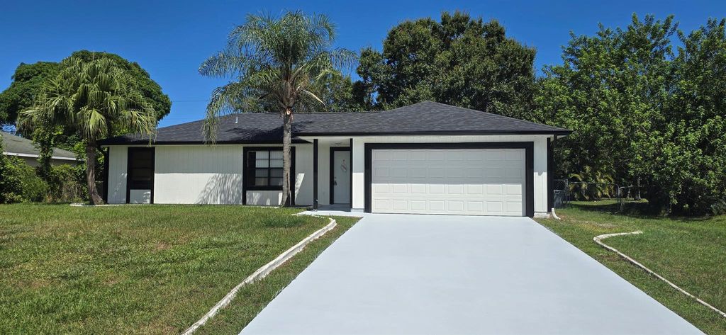 Photo of 2955 SW Varsity Lane, Port Saint Lucie, FL 34953 (MLS # R11117059)