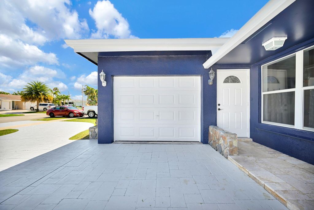 Photo of 11600 NW 30th Place, Sunrise, FL 33323 (MLS # B26023132)