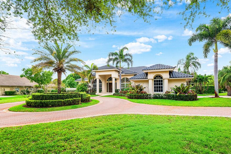 Located in the prestigious gated community of Cypress Head in Parkland, this elegant home sits on an oversized corner lot surrounded by estate-sized properties and custom homes. The residence features four spacious bedrooms, a private study, and three and a half bathrooms with a desirable split floor plan. The primary suite is privately positioned away from the additional bedrooms. Soaring ceilings and a dramatic floor-to-ceiling window fill the living area with natural light, opening to a spacious kitchen and bar ideal for entertaining. Hurricane impact doors and accordion shutters provide peace of mind. Step outside to a private pool and tranquil backyard, creating your own secluded sanctuary within one of Parkland's most sought-after communities.