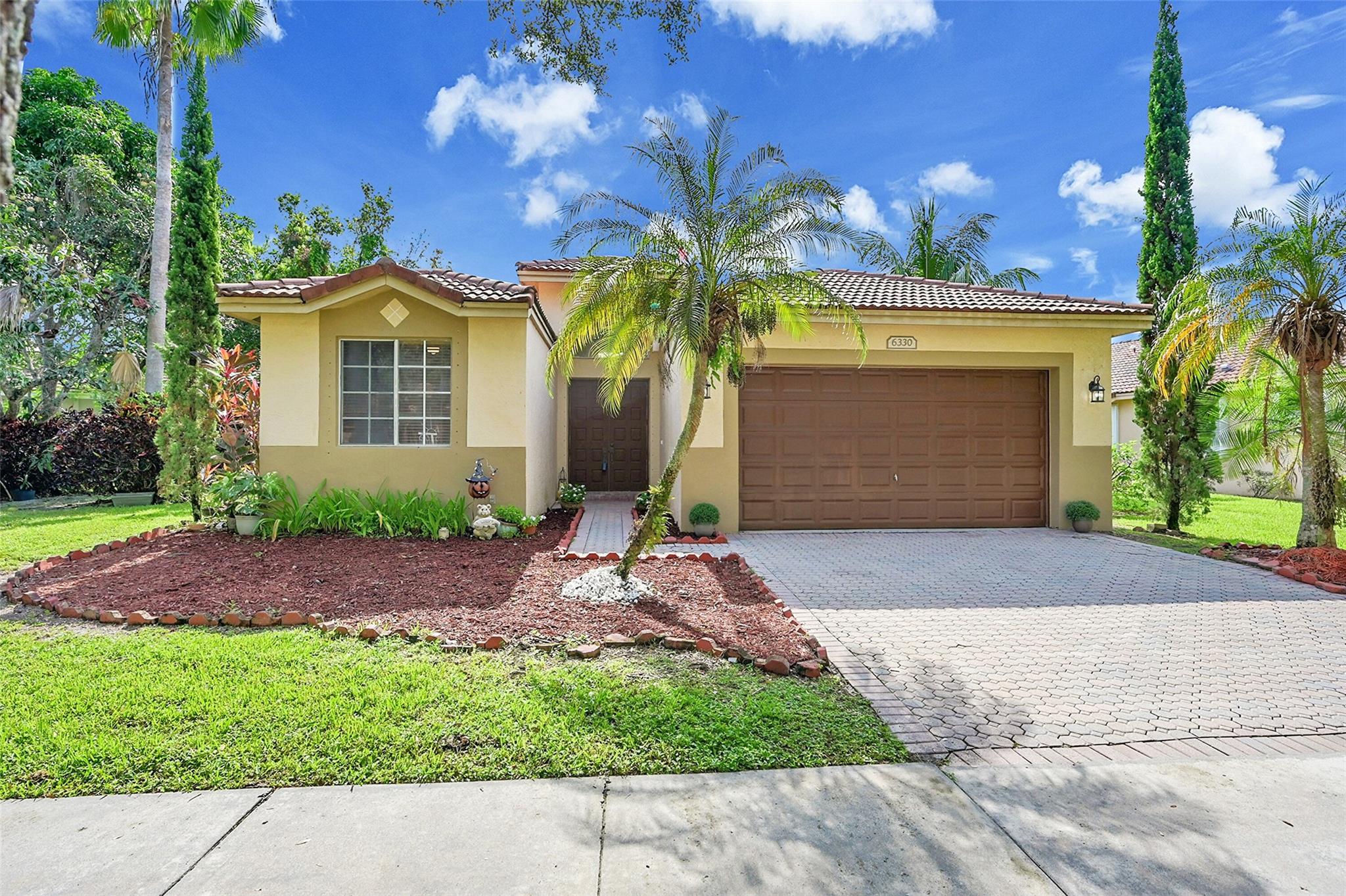 Your Lakeside Dream Awaits in Regency Lakes. Wake up every day to breathtaking lake views in this fully upgraded 4/2.5 oasis nestled in a quiet cul-de-sac. This rare gem offers a split floor plan w/soaring volume ceilings, stylish modern flooring, upgraded kitchen, new A/C, water heater, and upgraded bathroom. Step into your own tropical paradise—your spacious backyard is a private retreat filled w/ mangoes, lychees, limes, and more, perfect for morning smoothies or hosting weekend gatherings. Enjoy resort-style living w/ access to a sparkling community pool, clubhouse, gym, volleyball & tennis courts. You're just a short stroll away from shopping, fine dining, lush parks, & top-tier schools. Tech and security perks? HOA covers high-speed AT&T fiber internet, security, & landscaping.