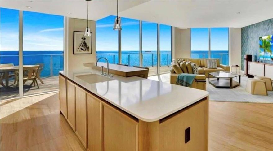 DIRECT OCEANFRONT SOUTHEAST CORNER WRAP-AROUND BALCONY FOUR SEASONS PRIVATE RESIDENCES, 4 bedroom, 4 1/2 bath and a southeastern exposure with direct ocean views . Dramatic floor to ceiling glass and gracious open wrap around terrace affords you ample natural light throughout the home. Gourmet kitchen with custom lacquered cabinetry, Sub Zero and Wolf appliances. Abundant illuminated closet space throughout this luxury residence. Baths are adorned with signature marble, custom oak cabinetry, and brushed nickel Waterworks fittings. Seamless/capless glass rails maximize your unobstructed views of the ocean. Assigned parking, either self park or valet as an exclusive VIP amenity offered to all residents.