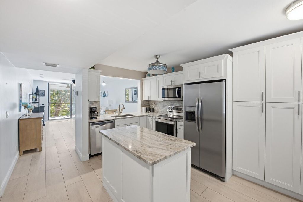 Photo of 3138 Via Poinciana #306, Lake Worth, FL 33467 (MLS # B26017850)