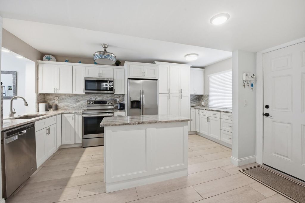 Photo of 3138 Via Poinciana #306, Lake Worth, FL 33467 (MLS # B26017850)