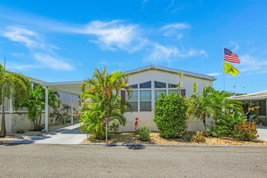 Enjoy Ocean Breezes all day at your beach cottage just one block from Juno Beach & the  fishing Pier.  This spacious manufactured home at Juno Ocean Condo (a 55+ community) offers a renovated kitchen and 2 spacious bedrooms and bathrooms.  There is a laundry room with a full size W/D set and plenty of storage for all your belongings. The inside space with over 1100 sq ft feels like HOME!  Windows galore -- sunlight abounds in every room of this furnished space !  The exterior offers a brand new roof and gutters (2018), a large carport sufficient for relaxing or parking your car(s) under the carport and the backyard which backs to a preserve for ultimate privacy has been beautifully landscaped with up-lighting for a lovely ambiance.  There is also a large shed for storage.  Want more?  Ther are NO HIGH HOA or LEASE FEES - you OWN THE LAND! BRAND NEW AC May 2019