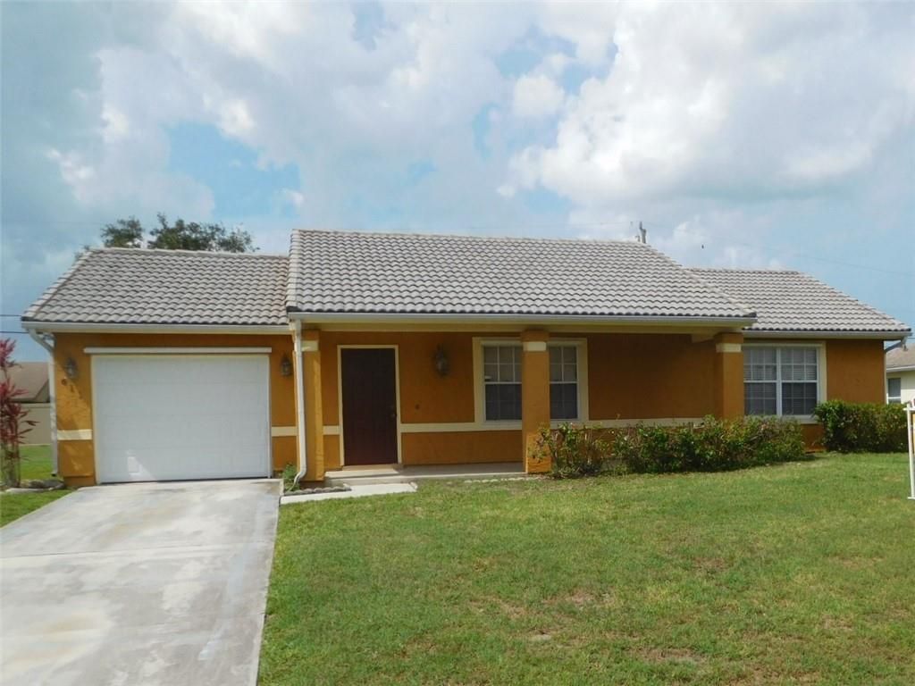 Photo of 611 SW Stillman Ave Ave, Port Saint Lucie, FL 34953 (MLS # F10334917)