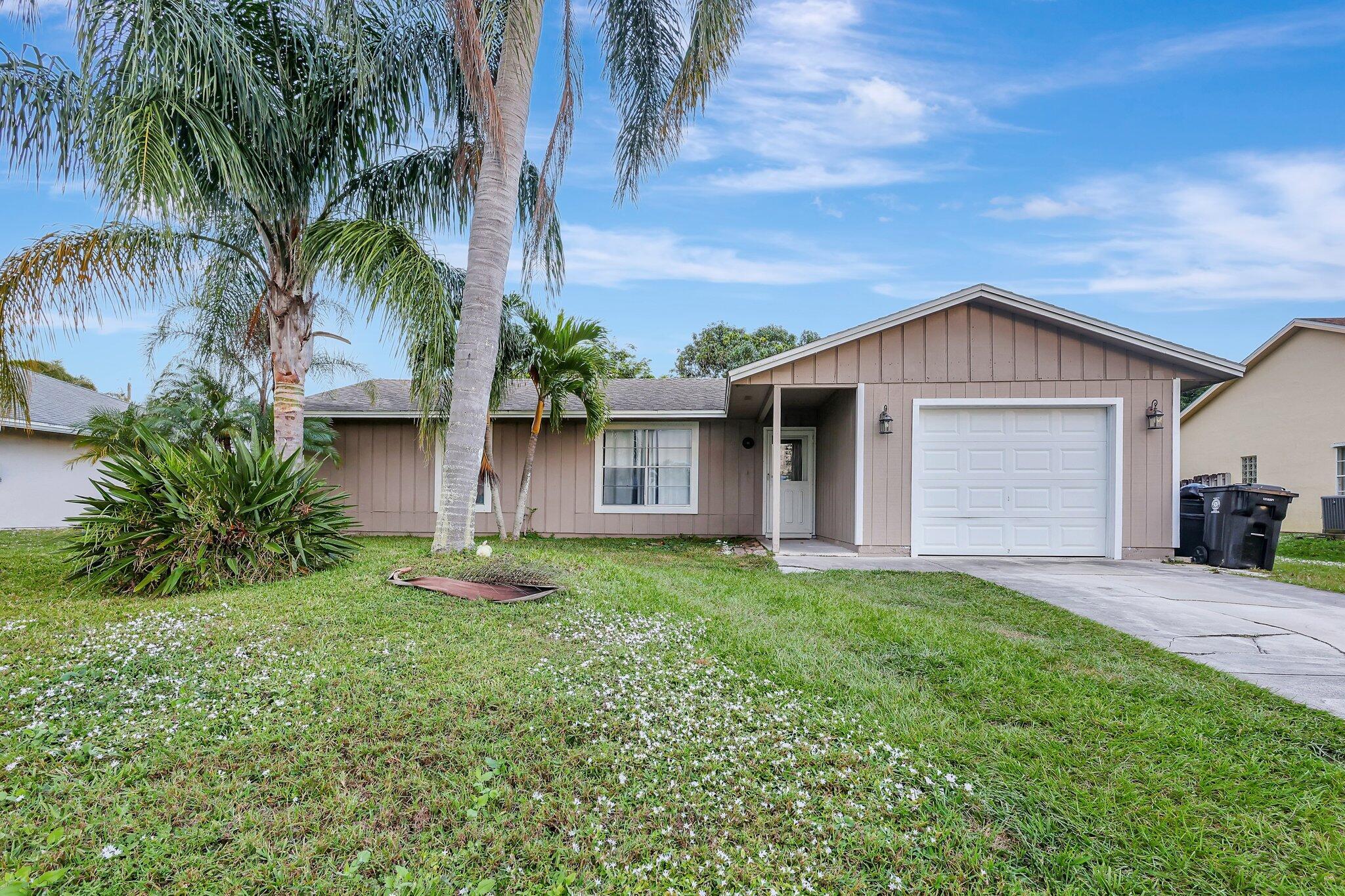 This 3 bedroom 2 bath home can be your dream home, by adding your personal touch!! Split bedroom floor plan, 3 bedrooms have walk-in closets in each. Kitchen area has a breakfast bar, glass sliders in dining area, large living room space, Tile flooring all through house, Remodeled bathroom, brand new ac unit, Spacious back yard with open patio, fruit trees and space for pool. Location is everything!! Near Turnpike, and I95! Shopping centers within minutes, zoned schools.