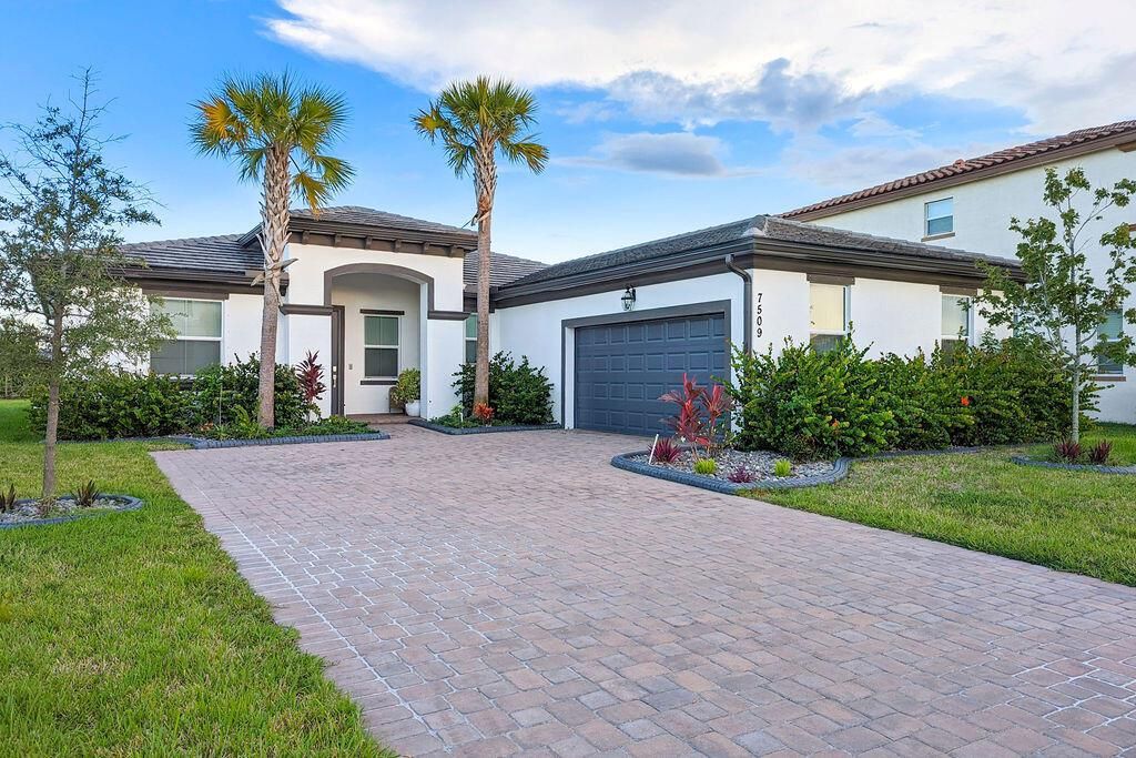 Photo of 7509 NW Farnsworth Circle, Port Saint Lucie, FL 34987 (MLS # R10977287)
