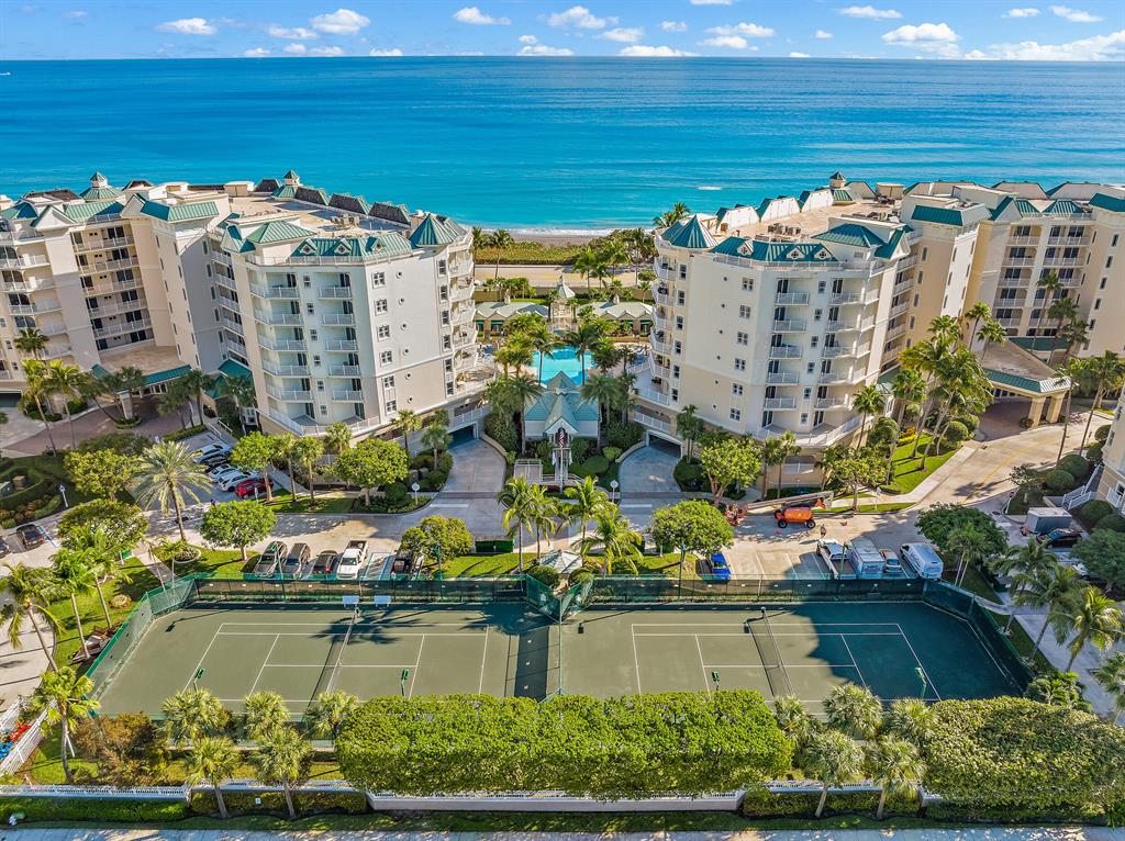 Unobstructed, beautiful ocean views span upon entry and from both ensuite bedrooms in this 5th floor unit! This pet friendly complex is steps from some of the best beaches on the eastern seaboard and equal, 20 minutes stroll, distance from the Jupiter Inlet (North) and Juno Beach Pier (South), where several beach miles are also dog friendly. Each bedroom offers ocean views over the top of lush palm trees, with floor to ceiling impact sliding doors allowing direct access to the stunning, oversized terrace. Boutique style building with 24-hr manned guard gate, key fob entry for building and the under-building garage, 18 total units, 3 per floor, each with 2 designated garage spaces. Amenities include resort style pool & spa, 2 fitness centers, lighted tennis courts, billiards & dog walk.