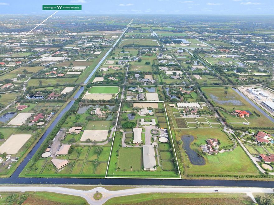 Reduced $1.8 Mil!  Private10.83-acre equestrian estate for the ambitious rider. 4Br/3.5Bth pool home with open concept living & expansive patio with screened cabana w/summer kitchen & bar, great for entertaining. There are 2 barns totaling 24 stalls. The 14-stall center-aisle barn with 5 grooming stalls boasts two 2Br/1Bth apartments, large center-island tack room, office w/ a full bathroom & 2 large storage garages. The second 10-stall courtyard barn also has two apartments, a 2Br/1Bth and a 1Br/1Bth.  There are multiple riding areas for training with an outdoor arena, grass grand prix field and CBS covered riding arena w/ viewing platform w/ subsurface watering systems for both arenas. There are 12 grass paddocks, 6-horsewalker, 2 covered outbuildings for aqua-treadmills & round pen.