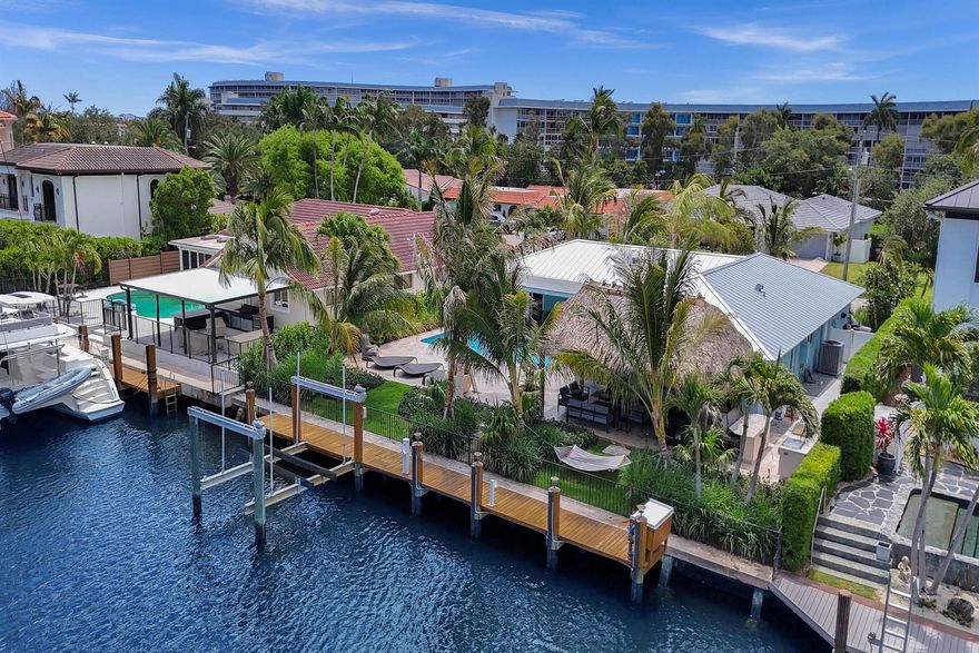 A Coastal Haven in Coveted Little Harbor!Welcome to 1107 Little Harbor Drive, a rare opportunity to own a meticulously maintained, luxuriously renovated and fully furnished 3-bedroom, 2-bathroom waterfront residence in one of Deerfield Beach's most sought-after enclaves. With 80 feet of pristine water frontage in a no-wake zone just off the Hillsboro River, this boater's paradise offers effortless access to the Intracoastal, Boca Inlet, and Hillsboro Inlet. Tucked beside a tranquil cove with sweeping views of both the exclusive estate homes and the protected beauty of Deerfield Island Preserve, this home provides a stunning and serene backdrop for everyday living. The dock, dock pilings, and a 16,000 lb boat lift, all installed in 2022, ensure a seamless boating experience.