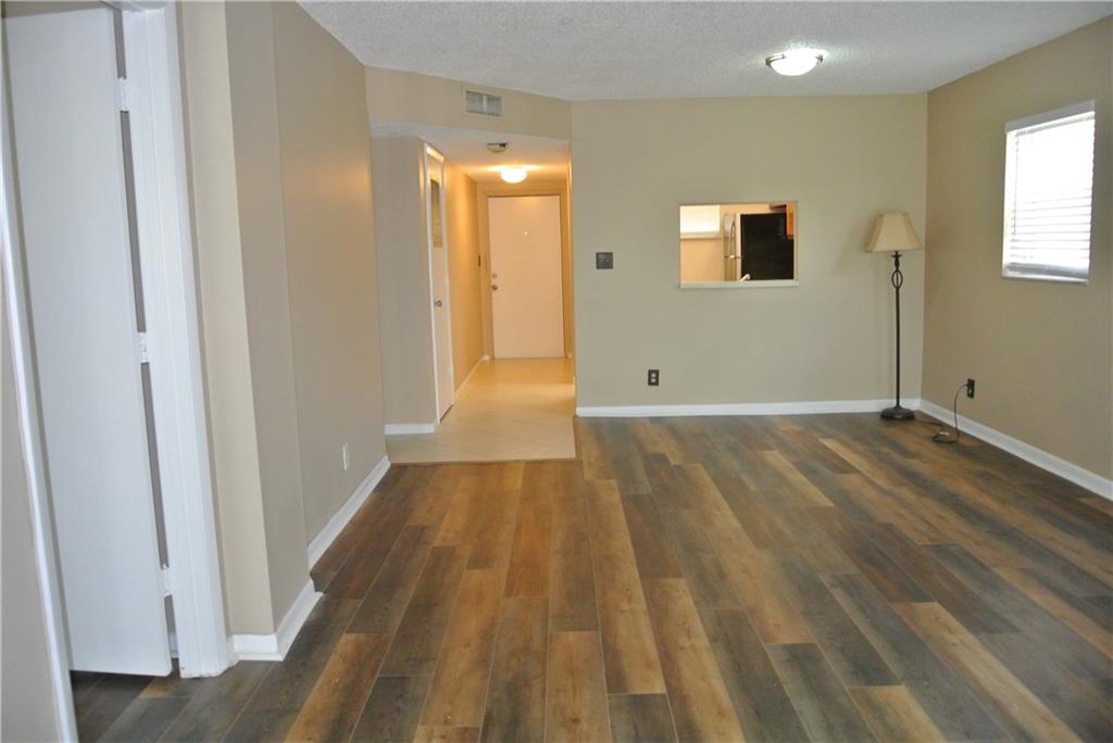 VERY SPACIOUS 2 bedroom/2 bath 3rd floor end unit in pristine community of Sherwood Square. Freshly painted, Beautiful Luxury Vinyl flooring and large tiled screened in patio. All Stainless steel appliances with newer dishwasher in large kitchen. Unit is light and bright with huge walk in closet in the primary bedroom. Clean & ready for immediate move in. Community has pool and tennis courts. Intercom security to get into building. Centrally located to transportation, shopping and restaurants.