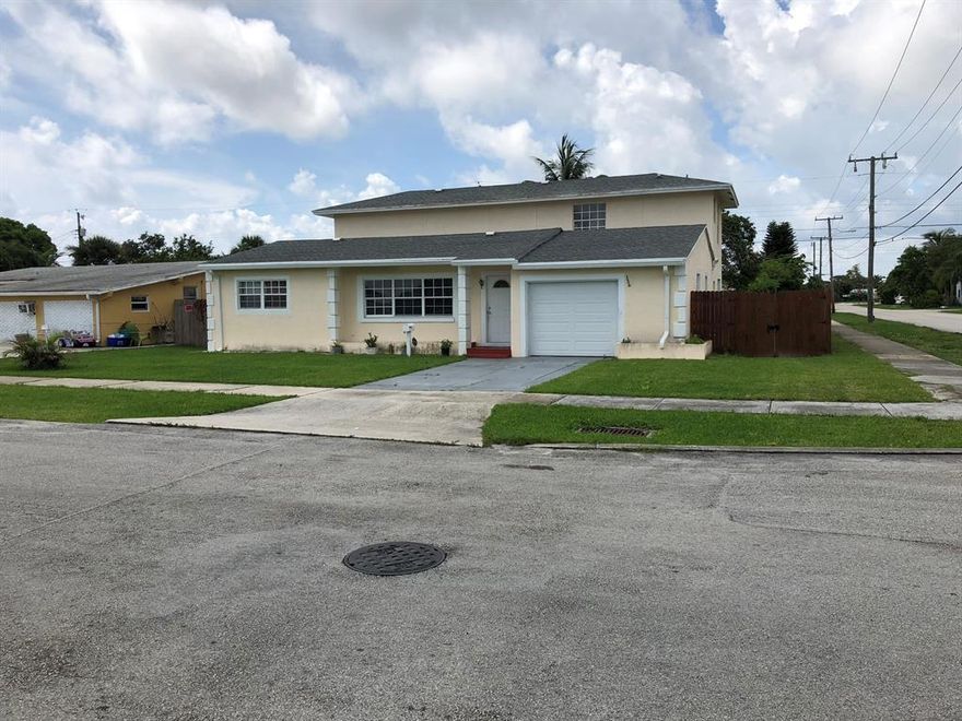 This Home Is A Rare Find, With A Separate Apartment Mother-In-Law Suite On Corner Lot, One Car Garage, Enjoy The Big Back Yard, The front house Has 2 Bedroom 1 Bath. The Back Apartment Is A Two Story 3 Bedrooms 2 Bathrooms. Walk to Park On Intracoastal, Only 5 Minutes To The Beach, Shopping, Restaurants And Highways.