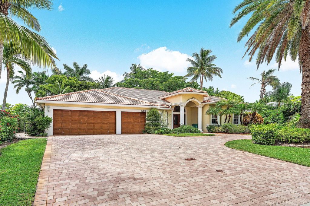 Photo of 589 N Country Club Drive, Atlantis, FL 33462 (MLS # R11120705)